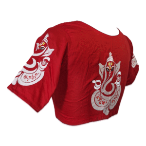 Red cotton blouse with embroidered Ganesha design on back and sleeves &ndash; side view.