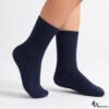 Person wearing navy blue cotton crew socks with soft stretch fit for daily comfort use